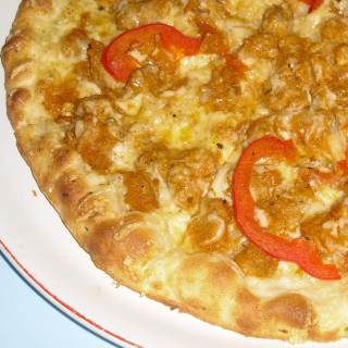 Americká 11. Pizza speciál(vepřové maso,pikantní pyré, papriky,sýr) 30 cm